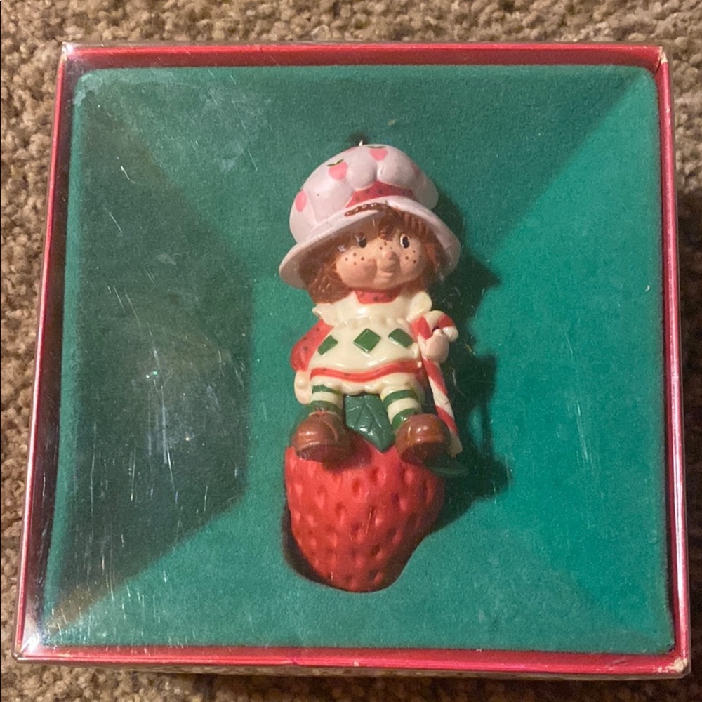 Vintage 1980 Strawberry Shortcake holding a candy cane Christmas Ornament.
